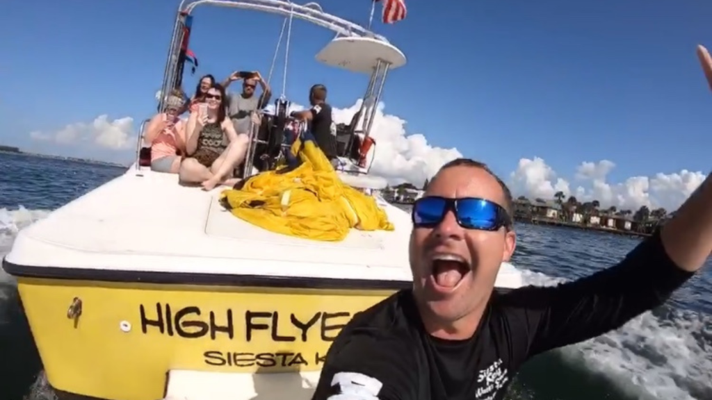Parasailing boat High Flyer operating in Siesta Key waters with guests enjoying a day on the Gulf