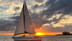 Sailboat silhouette at sunset on the Gulf in Siesta Key, Florida